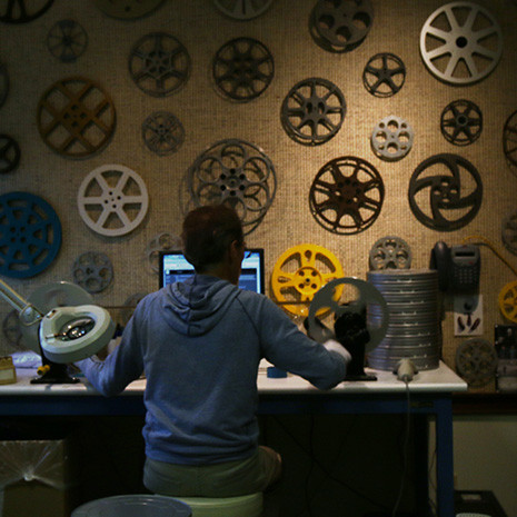 man at a desk editing film 
