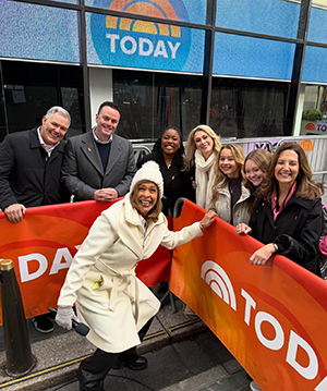 students and faculty standing outside the Today show with Hoda