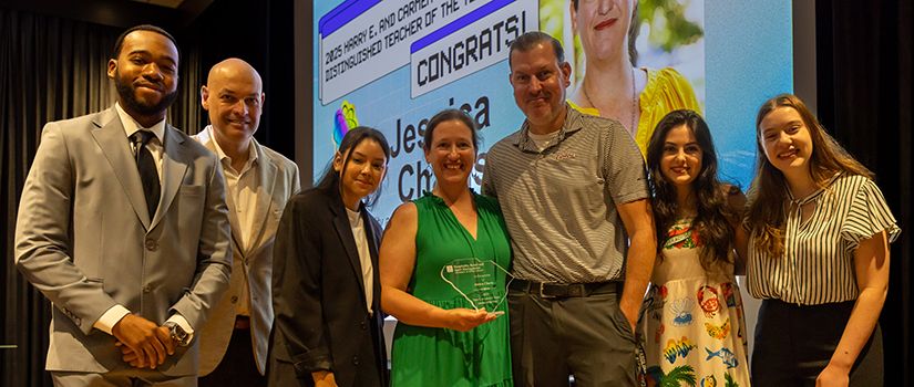 2025 Teacher of the Year Jessica Chavis with her husband and HRSM faculty and staff