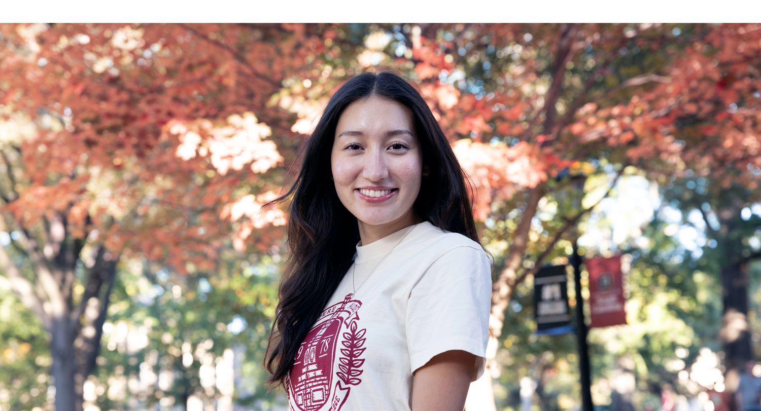 Head and shoulders photo of Hannah Brennen on the Horseshoe in fall