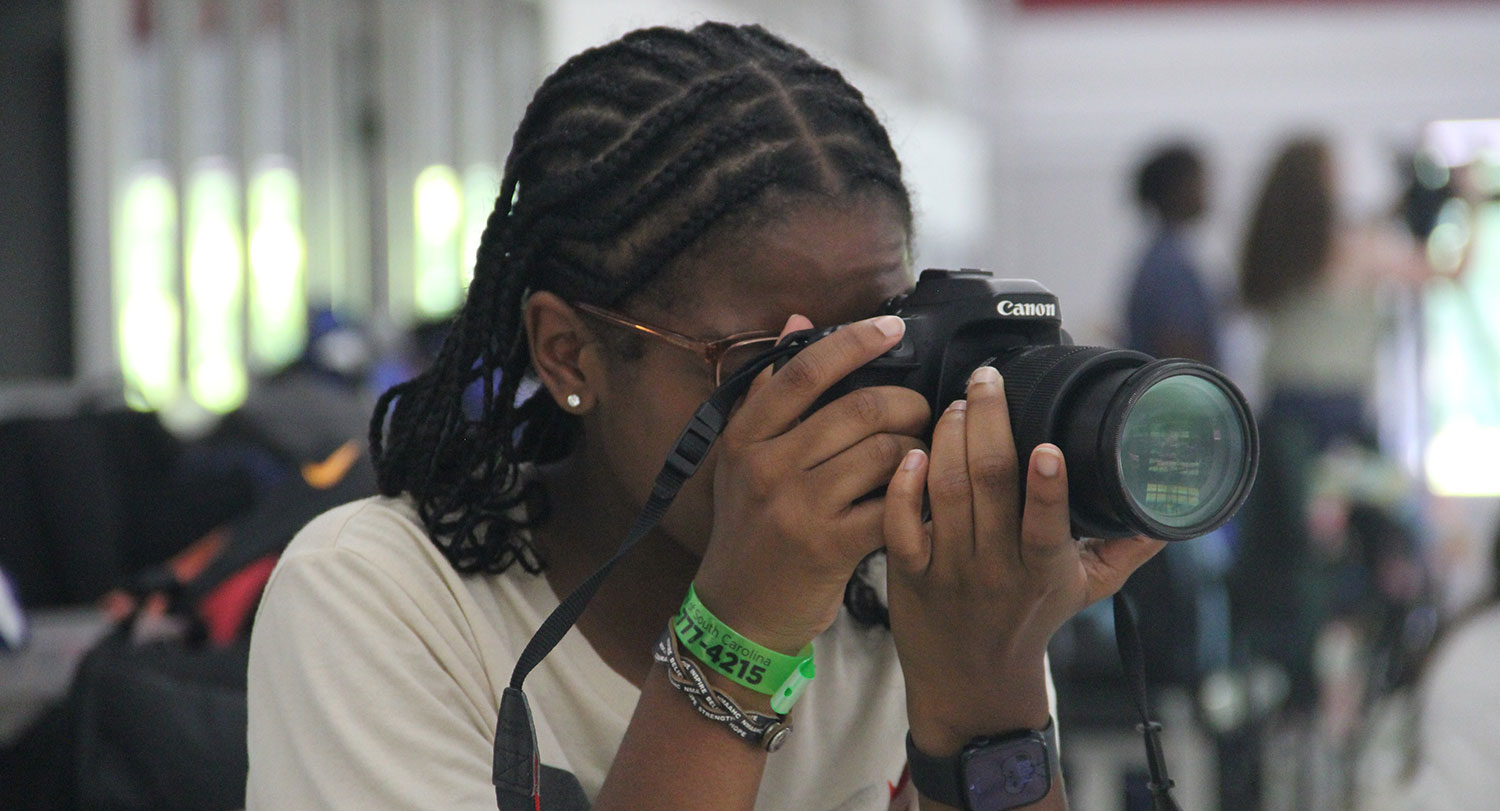 Female student using a camera