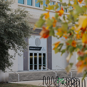 Exterior of USC's Swearingen Engineering building with fall foliage in the foreground