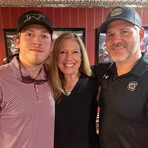 Connor Newsome with his parents